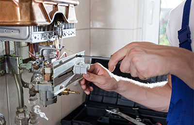 Person repairing a boiler system