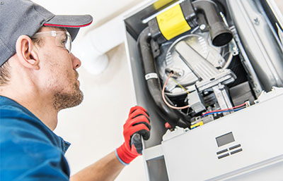 Man servicing boiler