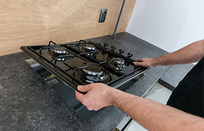 Man installing gas hob